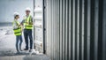 Staff workers inspecting shipping container. Royalty Free Stock Photo