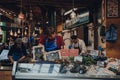 Staff working at a Shellseekers fishmonger stall in Borough Market, London, UK