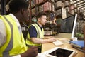 Staff working in on-site office at a distribution warehouse Royalty Free Stock Photo