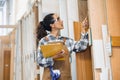 staff working in wood furniture industry factory checking selecting plywood wooden board type material in stock warehouse