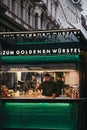 Staff working at the Zum Goldenen Wursten `The Golden Sausages` stand in Vienna, Austria. Royalty Free Stock Photo