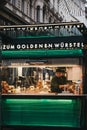 Staff working at the Zum Goldenen Wursten `The Golden Sausages` stand in Vienna, Austria.