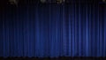 The stage is closed by a curtain of saturated bright blue. Royalty Free Stock Photo