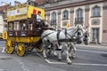 A stage coach moves along a road at warsaw in Poland.