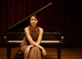 Stage, concert and portrait of Asian woman with piano for performance, entertainment and talent show. Musician, creative Royalty Free Stock Photo