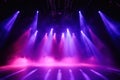 Stage with dynamic LED lighting and theatrical haze atmosphere Royalty Free Stock Photo