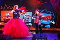 On stage, the expressive red-haired violinist Maria Bessonova sons twins. violin trio two generations of red fiery musicians.