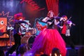 On stage, the expressive red-haired violinist Maria Bessonova sons twins. violin trio two generations of red fiery musicians.