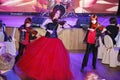 On stage, the expressive red-haired violinist Maria Bessonova sons twins. violin trio two generations of red fiery musicians.