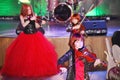 On stage, the expressive red-haired violinist Maria Bessonova sons twins. violin trio two generations of red fiery musicians.