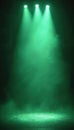 Stage with green spotlights illuminating smoke and mist. Dark background with stage structure and bright light rays creating Royalty Free Stock Photo