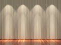 Stage with light brown curtains and spotlight.
