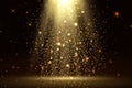 Stage light and golden glitter lights effect with gold rays, beams and falling glittering dust on floor. Abstract gold background Royalty Free Stock Photo