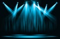 Stage lights. Blue spotlight with certain through the darkness. Royalty Free Stock Photo
