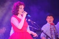 On stage, the musicians pop-rock group Spearmint and singer Anna Malysheva. Red headed Jazz Rock Girl singing. Royalty Free Stock Photo