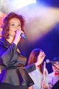 On stage, the musicians pop-rock group Spearmint and singer Anna Malysheva. Red headed Jazz Rock Girl singing. Royalty Free Stock Photo