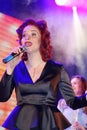 On stage, the musicians pop-rock group Spearmint and singer Anna Malysheva. Red headed Jazz Rock Girl singing. Royalty Free Stock Photo