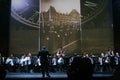 On stage, the musicians and soloists of Orchestra of accordionists (harmonic orchestra) under the baton of conductor.