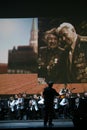 On stage, the musicians and soloists of Orchestra of accordionists (harmonic orchestra) under the baton of conductor.