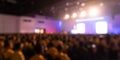 Stage show blur background with crowd audience in theatre hall and lighting bokeh for concert event or music performance