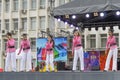 On stage singing a children's musical group