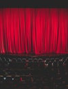 Stage with velvet red curtain in theater cinema, empty old-fashioned elegant theatre wooden stage with red cloth drapes curtains Royalty Free Stock Photo