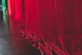 Stage with velvet red curtain in theater cinema, empty old-fashioned elegant theatre wooden stage with red cloth drapes curtains Royalty Free Stock Photo