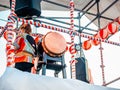 The stage of the Yagura with a drummer girl big japanese taiko drum Wadaiko. Paper red-white lanterns Chochin Scenery