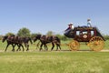 Stagecoach lead by a team of 4 horses Royalty Free Stock Photo