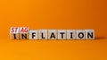 Stagflation or inflation symbol. Turned wooden cubes and changed the concept word inflation to stagflation. Beautiful orange Royalty Free Stock Photo