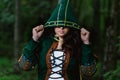 Staging photo of beautiful woman in fantasy suit with hood