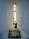 Stain glass window with Celtic monks manuscript