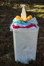 stain remover on a pile of dirty clothes