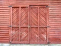 Red stain wood barn doors with black hinges