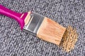 Stained carpet with paint brush Royalty Free Stock Photo