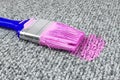Stained carpet with paint brush Royalty Free Stock Photo