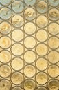 A stained glass background, old church window with stained glass, opaque yellow circles Royalty Free Stock Photo