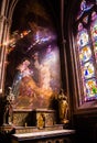 Stained glass and canvas in the chapel of Cathedrale Saint-Corentin de Quimper. This is the is the seat of the Bishops of Quimper- Royalty Free Stock Photo