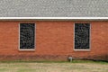 Stained glass church windows red brick wall Royalty Free Stock Photo