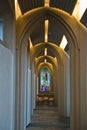 Stained glass at the corridor with arches inside Hallgrimskirkja, Reykjavik cathedral Royalty Free Stock Photo