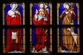 Stained Glass - Jesus Christ, Saint Roch and Saint Charles Borromeo Royalty Free Stock Photo