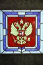 Stained glass `ÃÂ¡oat of Arms of Russia` on the marble wall is located in the shopping center `Children`s world`.