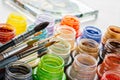 Stained glass paints and paint brushes, artisan painting on glass surface. Royalty Free Stock Photo