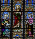 Stained Glass - Saint Anna, Jesus and the Sacret Heart and the A Royalty Free Stock Photo