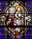 Stained Glass - Saint Conteste resists Satan Royalty Free Stock Photo