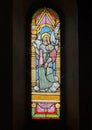 Stained glass of Saint Gabriel the Archangel carrying a lily in the Holy Savior Church in Castellina in Chianti, Italy.with