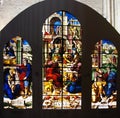 Stained glass window with biblical scenes