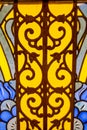 The stained glass window is bright and beautiful in the form of an ornate pattern of yellow blue color. World tourism