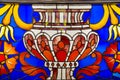 The stained glass window is bright and beautiful in the form of a vase of blue red yellow yellow. World tourism flowers