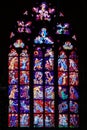 Stained glass window with Catholic icons in st. Vitus Cathedral, Prague.